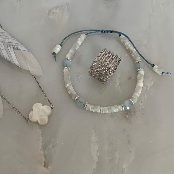 Silver chain necklace with faceted white mother-of-pearl cross
