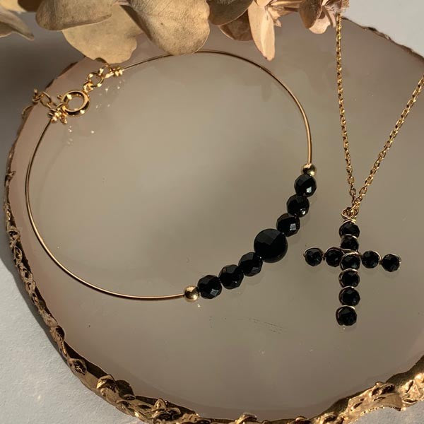 Gold plated chain necklace with small onyx cross