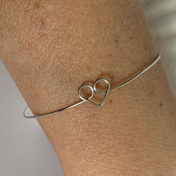 Thin silver heart bangle bracelet