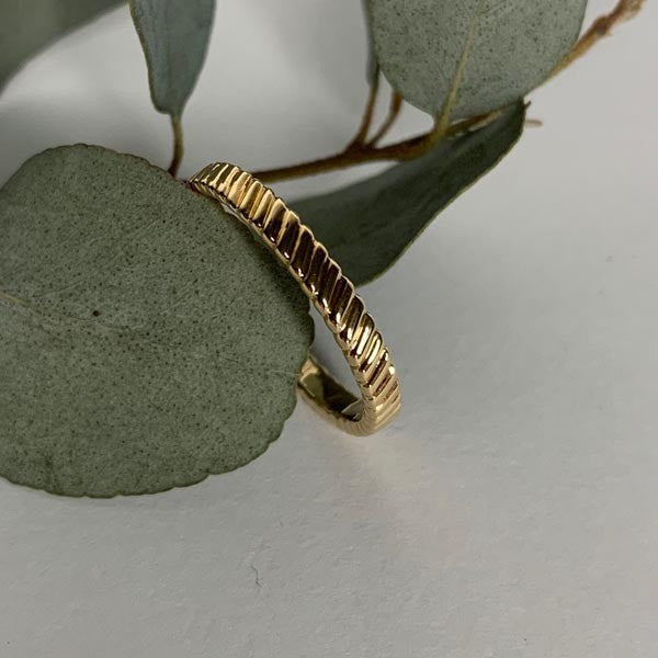 Thin gold-plated ring with stripes