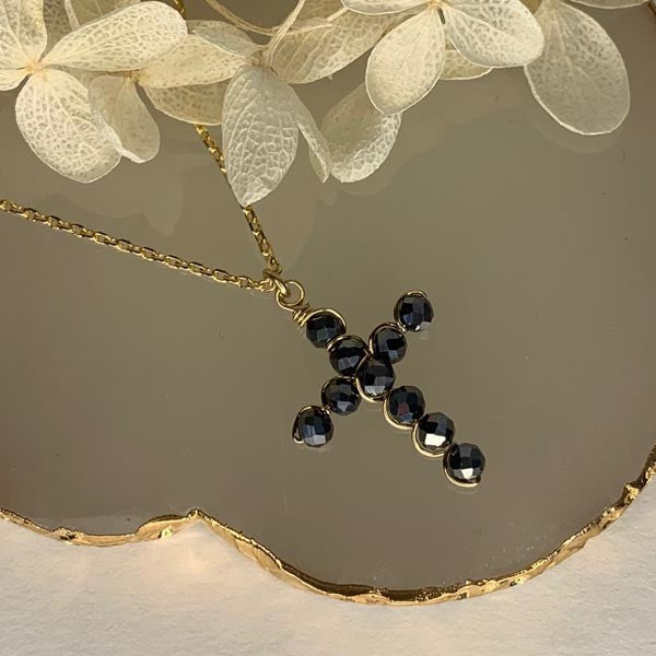 Gold plated chain necklace with small hematite cross