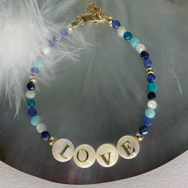Gold plated Love bracelet with blue stones