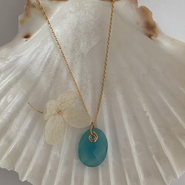 Gold plated chain necklace with oval faceted blue chalcedony