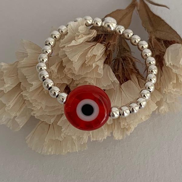Mini silver pearl ring with red eye