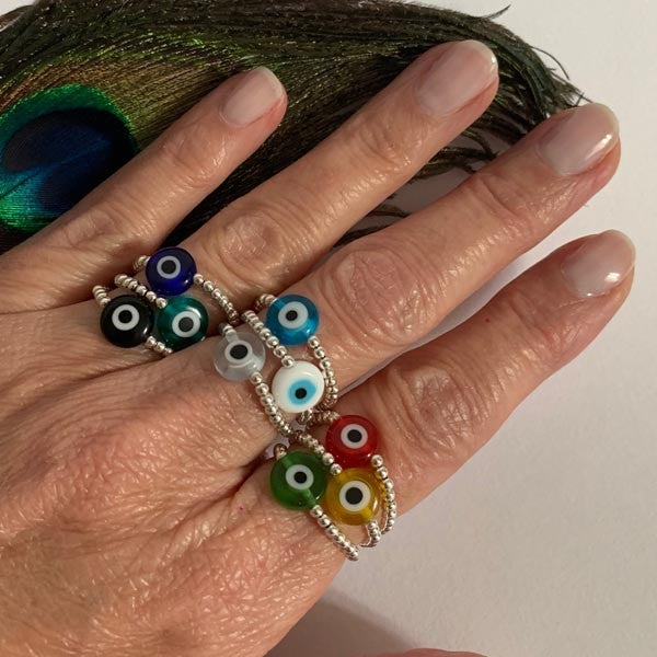 Mini silver pearl ring with green eye