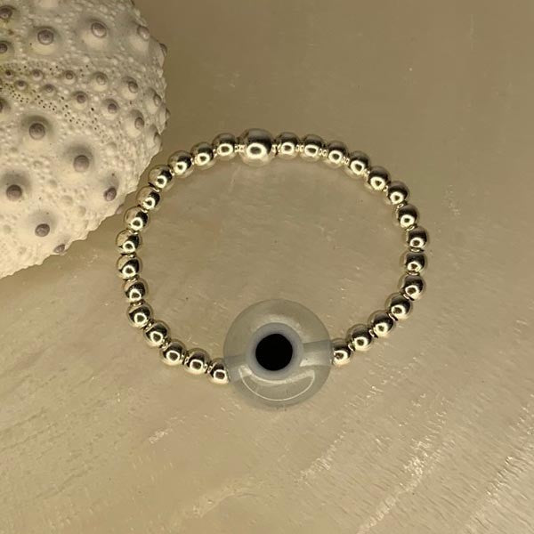 Mini silver pearl ring with transparent eye