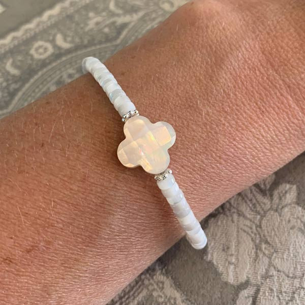 Heishi bracelet with white mother-of-pearl cross and pearls