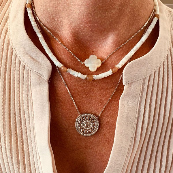 Silver chain necklace with faceted white mother-of-pearl cross