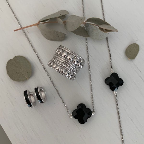 Silver chain bracelet with faceted onyx cross