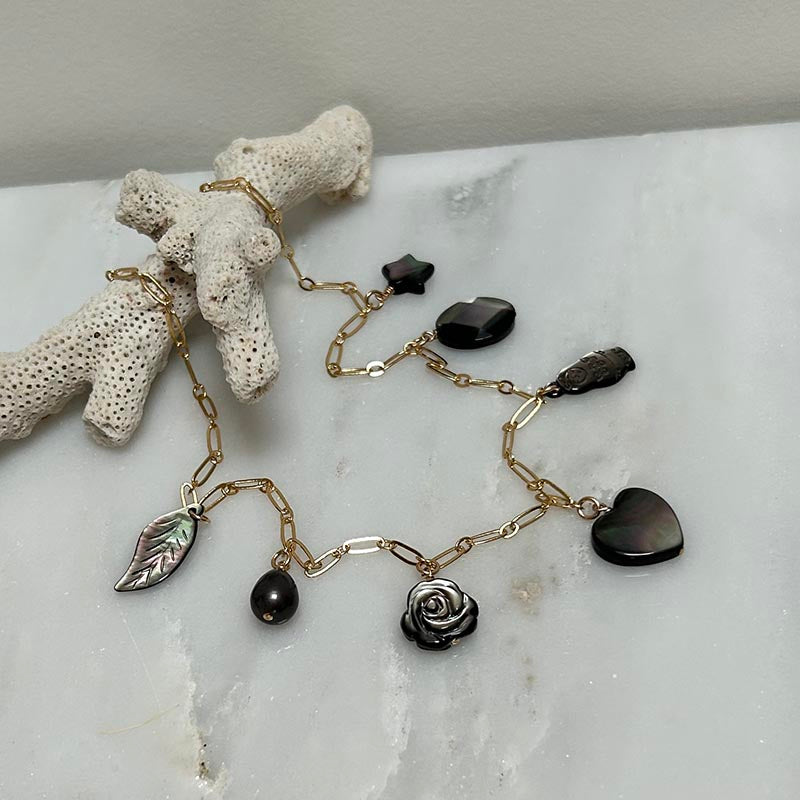 Gold plated chain necklace with 7 small white pearls