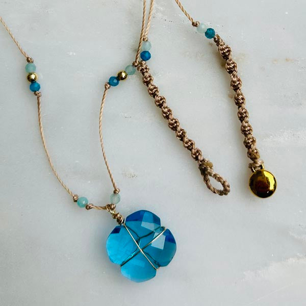 Gold plated chain necklace with oval faceted blue chalcedony