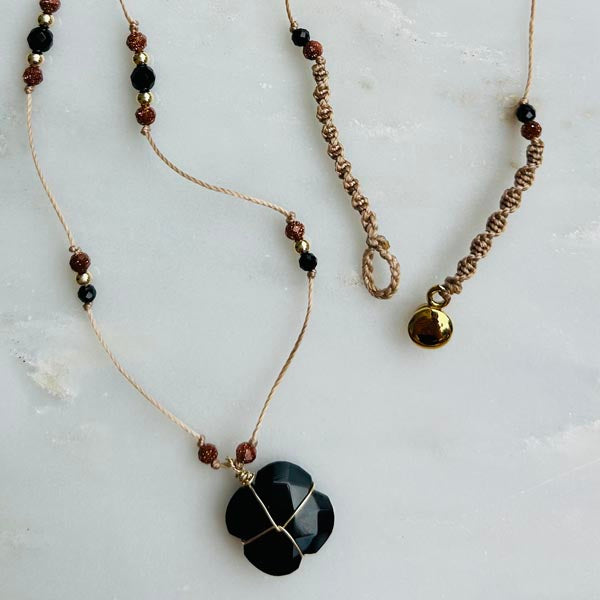 Gold plated chain necklace with oval faceted blue chalcedony