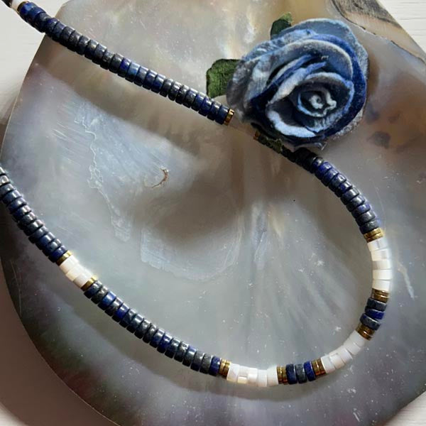 Heishi necklace with white mother-of-pearl cross and pearls