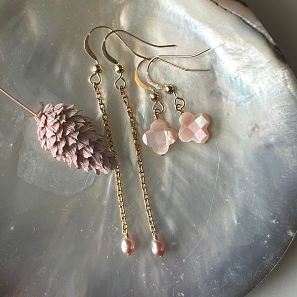 Silver earrings with white mother-of-pearl cross and faceted pompoms