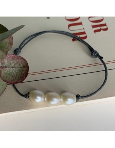 Three white freshwater pearls with...