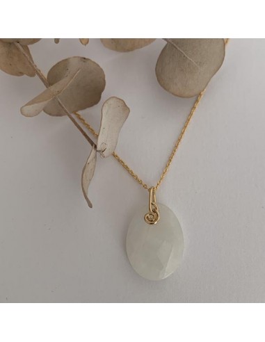Gold plated faceted white oval...