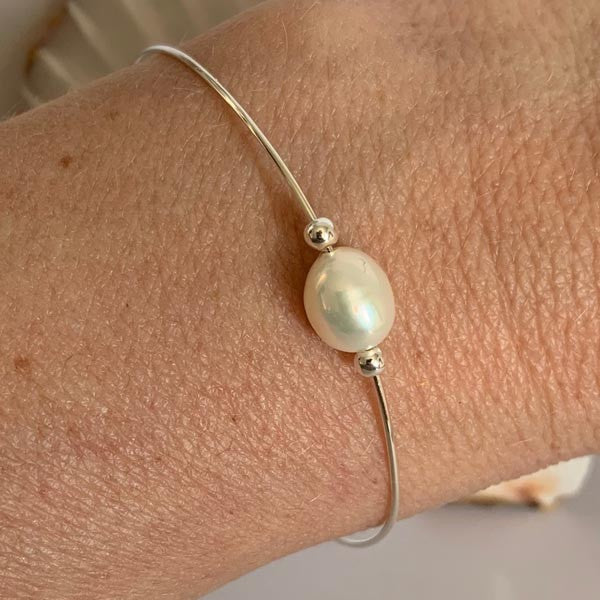 Fine silver bangle bracelet with white pearls