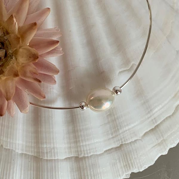 Fine silver bangle bracelet with white pearls