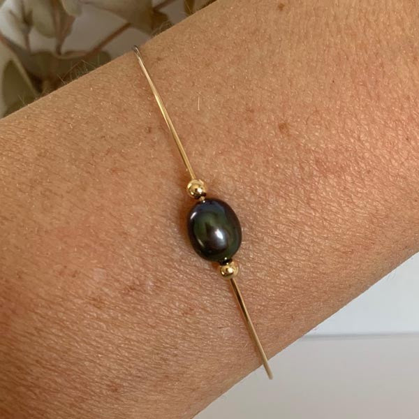 Fine gold filled bangle bracelet with oval black pearl beads