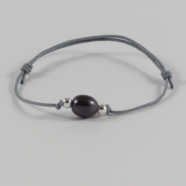 Black freshwater pearl cord bracelet with oval silver beads 