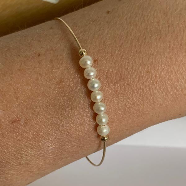 Fine gold filled bangle bracelet with 7 white pearls