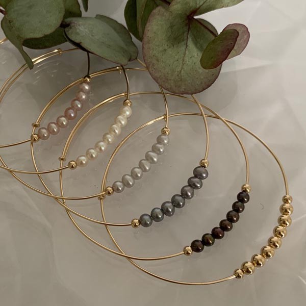 Fine gold filled bangle bracelet with 7 gray beads