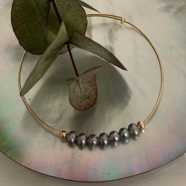 Fine gold filled bangle bracelet with 7 gray beads