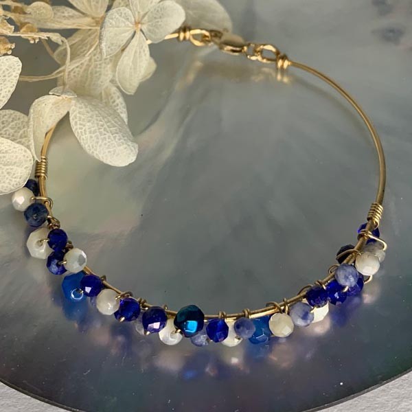 Fine gold filled bangle bracelet with blue stones