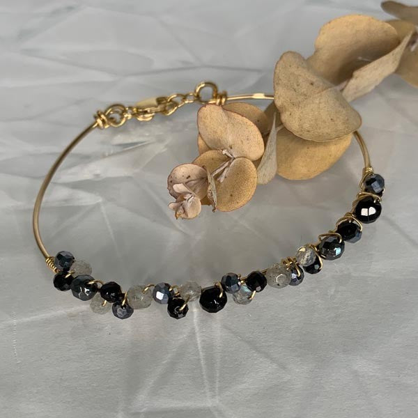 Thin gold filled bangle bracelet with gray stones