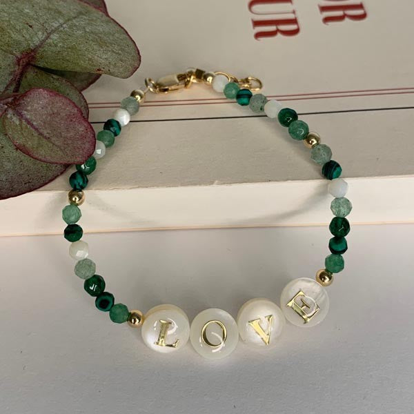 Gold plated Love bracelet with green stones 