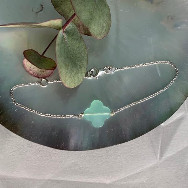 Silver chain bracelet with faceted water green cross