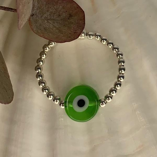 Mini silver pearl ring with green eye 