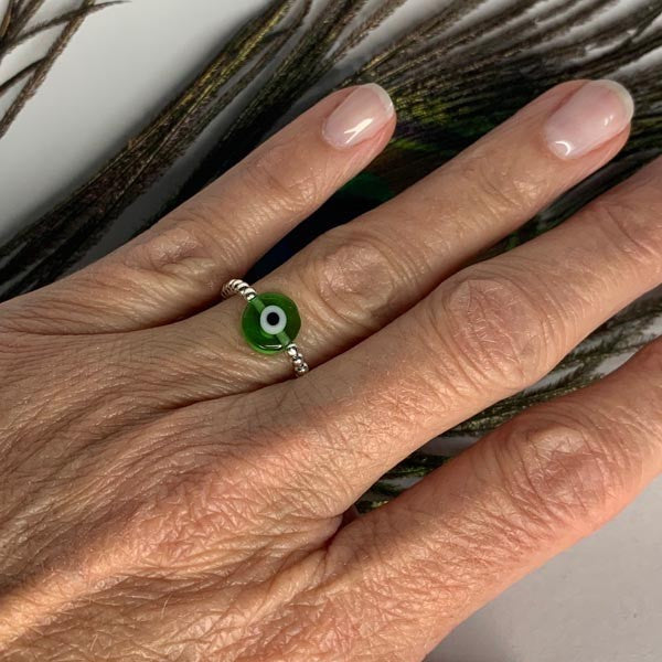 Mini silver pearl ring with green eye 