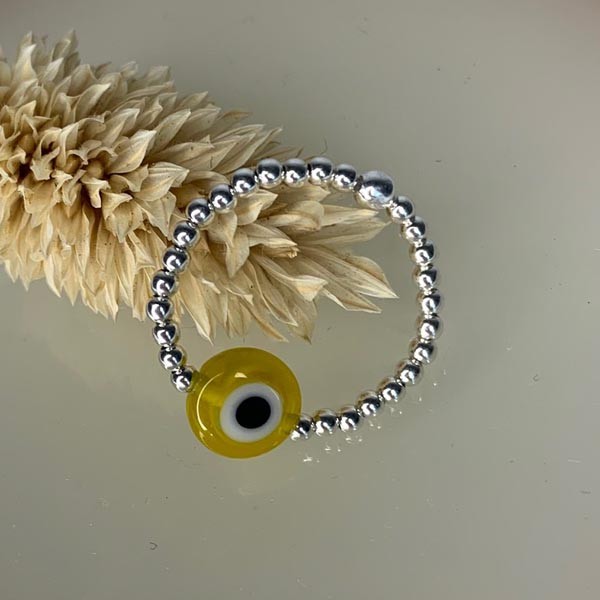 Mini silver pearl ring with yellow eye