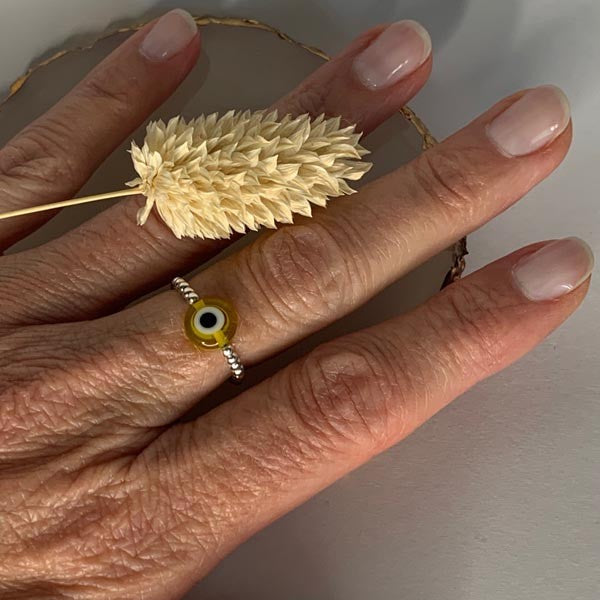 Mini silver pearl ring with yellow eye