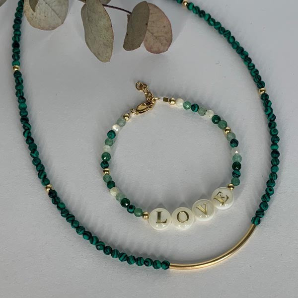 Gold plated Love bracelet with green stones 