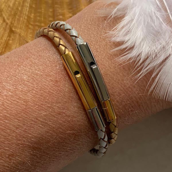 Duo of braided gold and silver leather bracelets