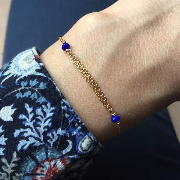 Gold plated chain bracelet with triple chains and small blue stones