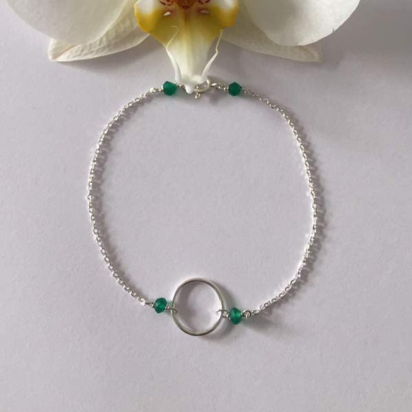 Silver chain bracelet with small green onyx ring