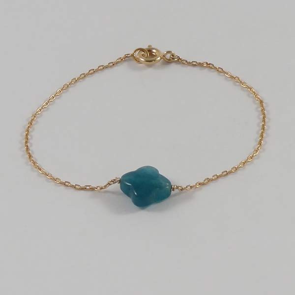 Gold plated chain bracelet with faceted cross in duck green