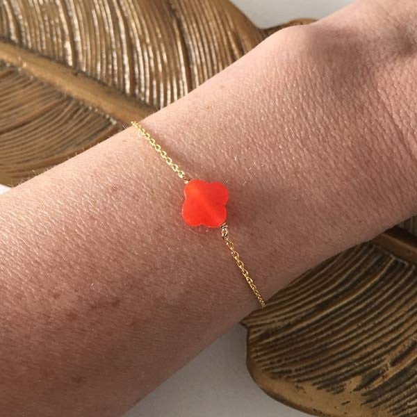 Gold plated chain bracelet with orange faceted cross