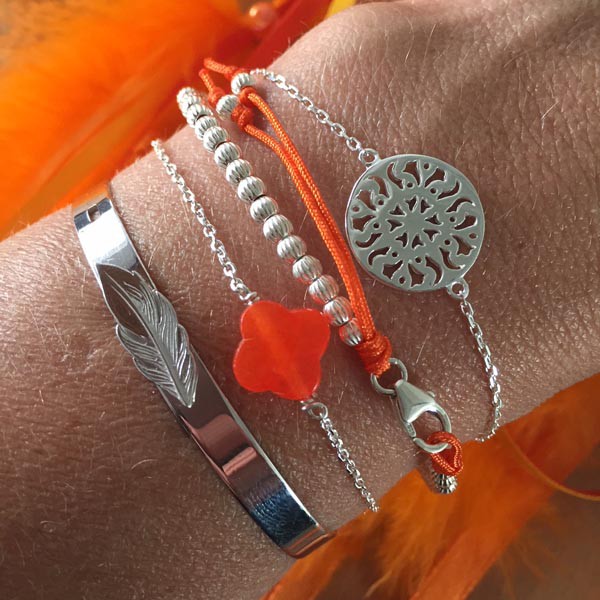 Silver chain bracelet with faceted orange cross