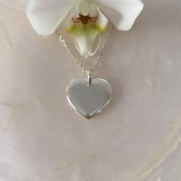 Silver chain necklace with heart medal