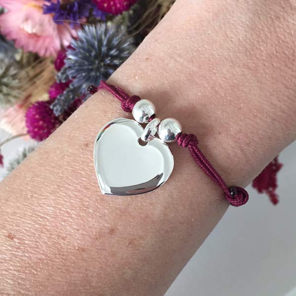 Silver heart medal cord bracelet with pearls