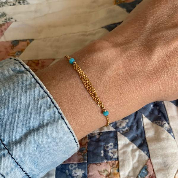 Gold plated chain bracelet with triple chains and small turquoise stones