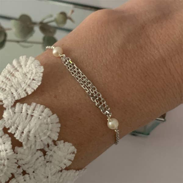 Triple silver chain bracelet with small white freshwater pearls 