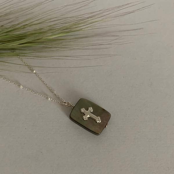 Silver chain necklace with mini gray mother-of-pearl balls and small rectangle cross