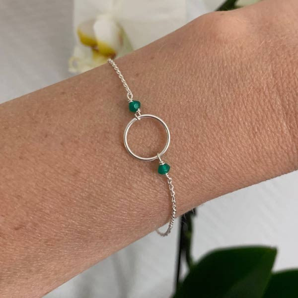 Silver chain bracelet with small green onyx ring