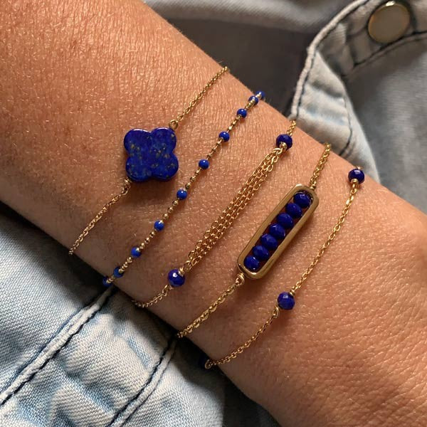 Gold plated chain bracelet with triple chains and small blue stones