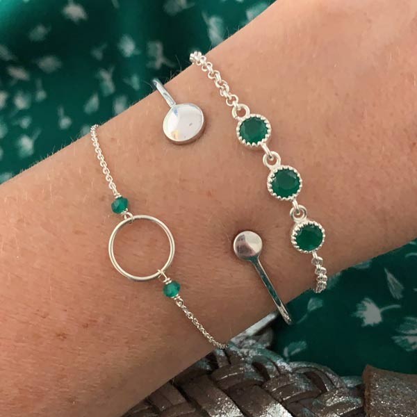 Silver chain bracelet with small green onyx ring